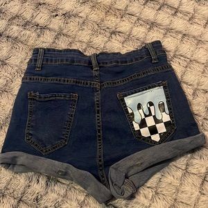 Jean shorts with graphic design on back pocket